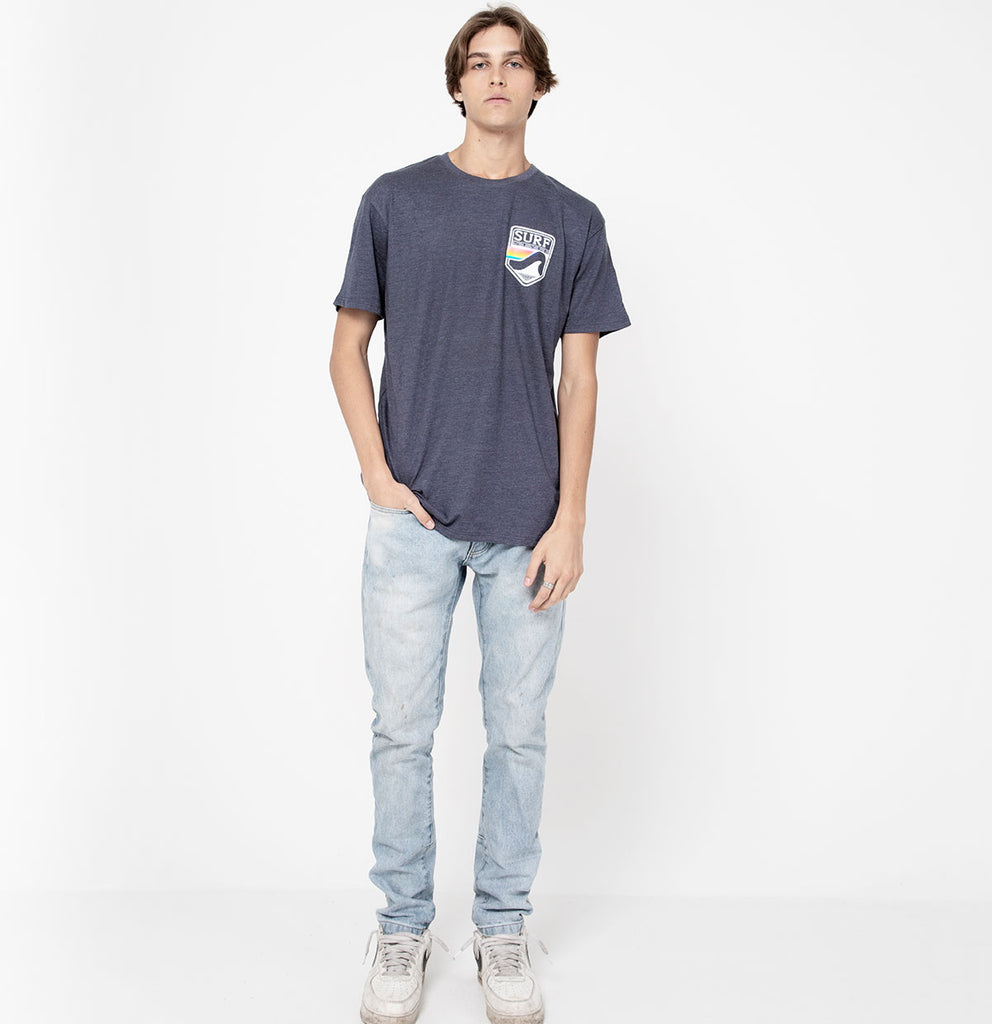 male full body photo for the Surf Style Pastel Shield shirt on heathered blue shirt