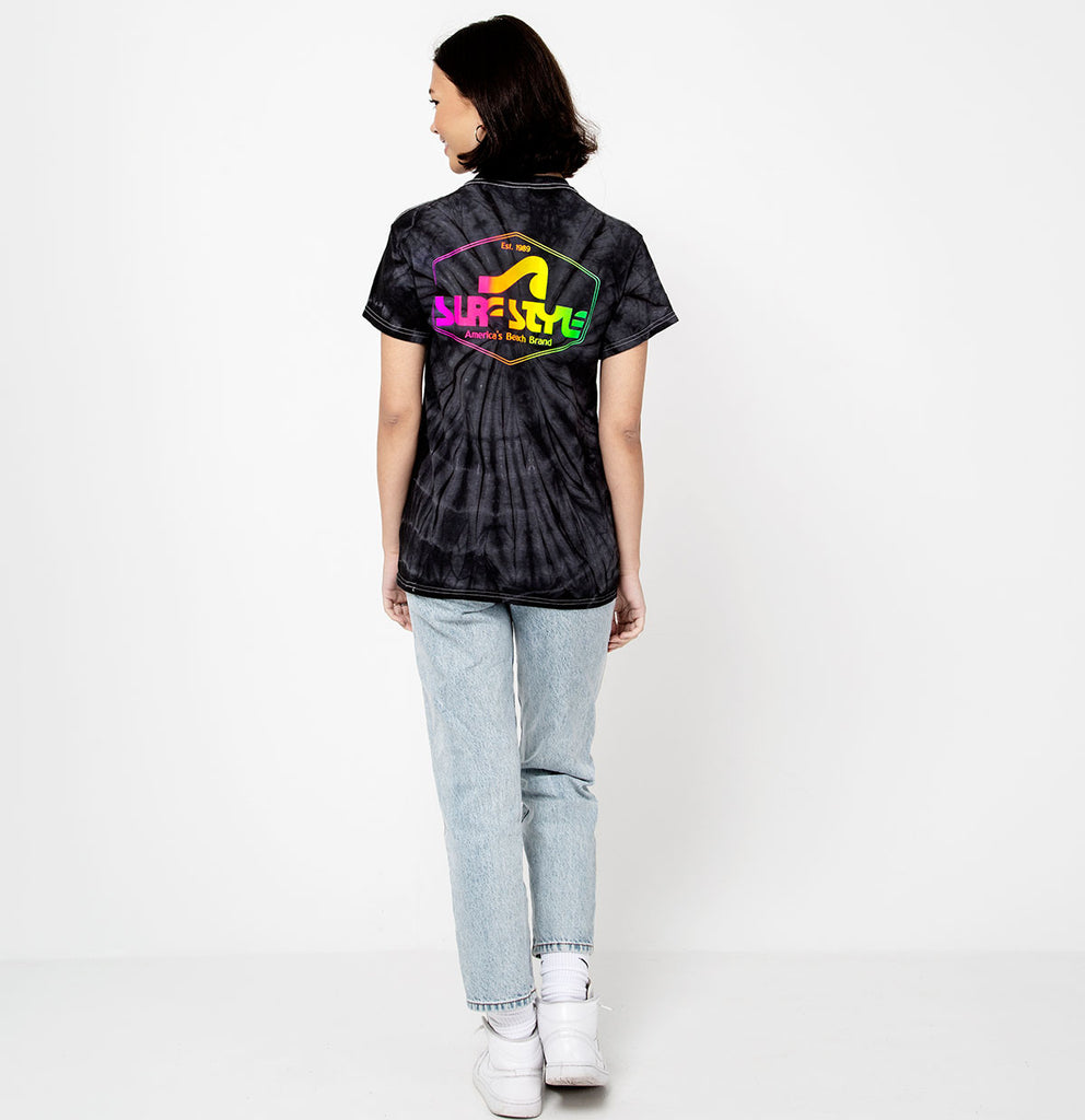 female showing the back of the Surf Style Dark Tie Dye Neon Shield Logo shirt