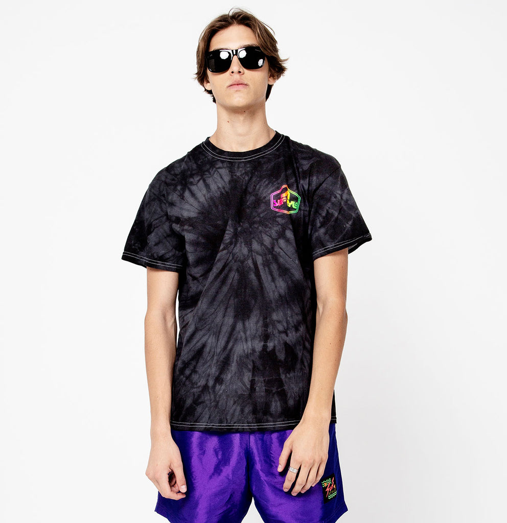male wearing cool glasses showing the front of the Surf Style Dark Tie Dye Neon Shield Logo shirt