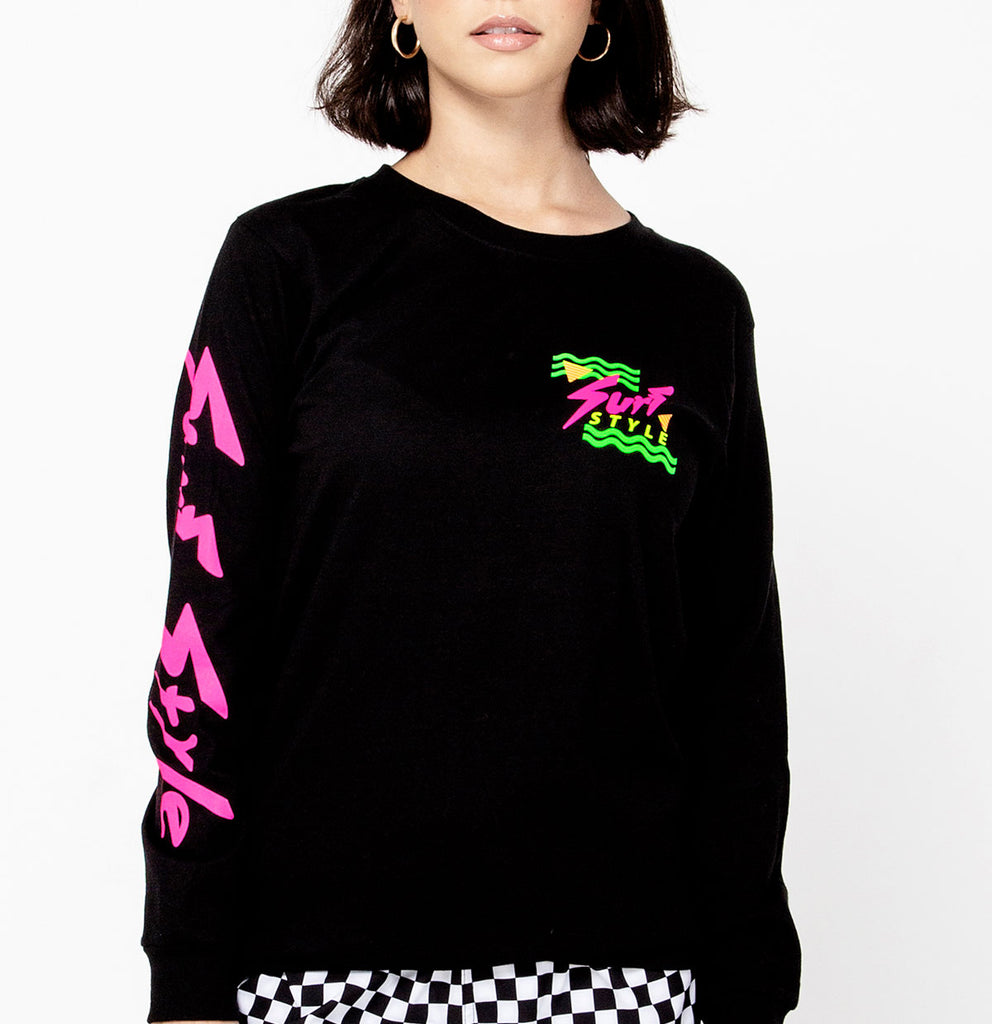 female showing the front of the Surf Style Retro 80's Logo Long Sleeve shirt