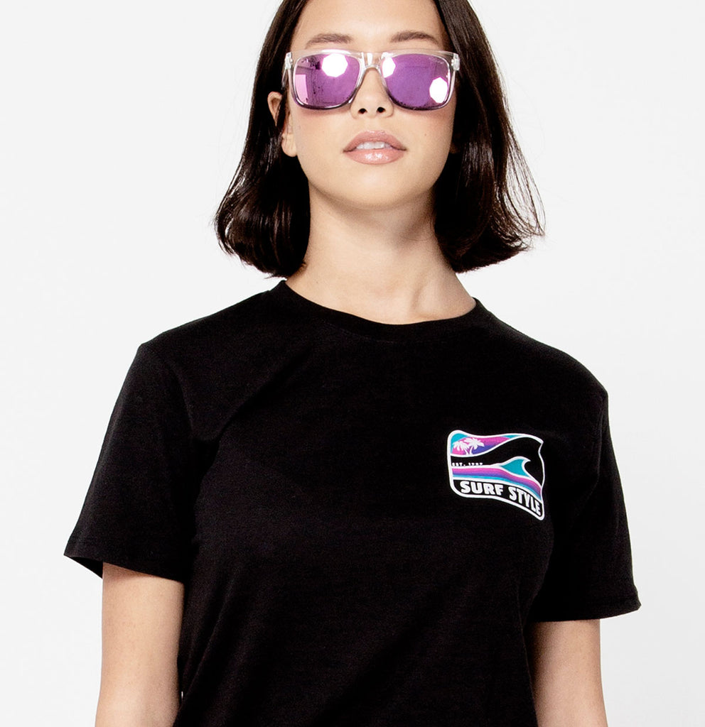 front of female wearing cool glasses and a Surf Style Box Wave Logo Tee
